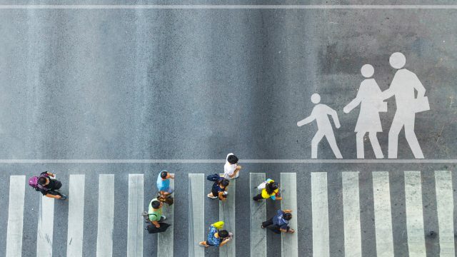People walking over crossroad that was created for a seamless journey for citizens