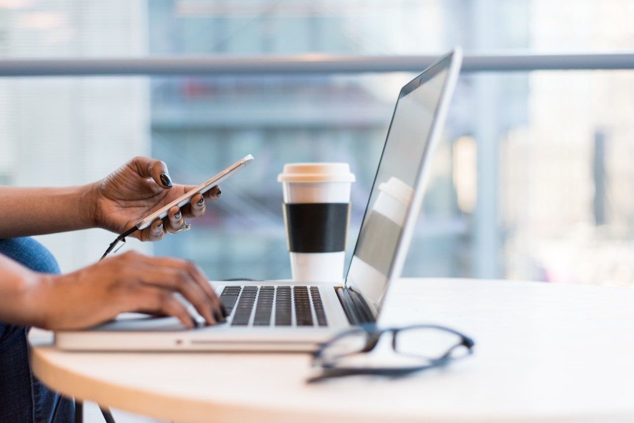 Woman, laptop, phone