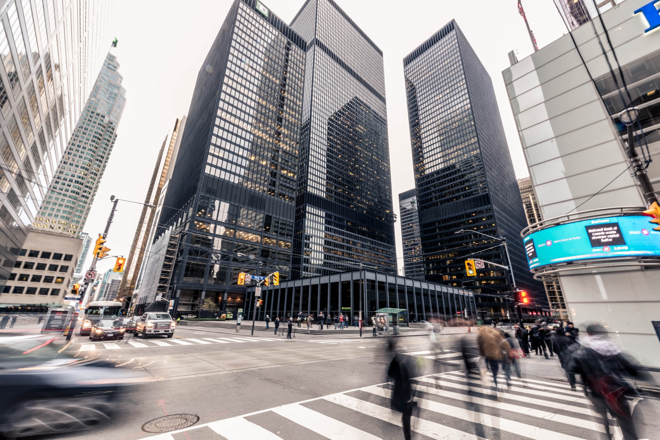 financial district, skyscraper, pedestrians crossing zebra, traffic