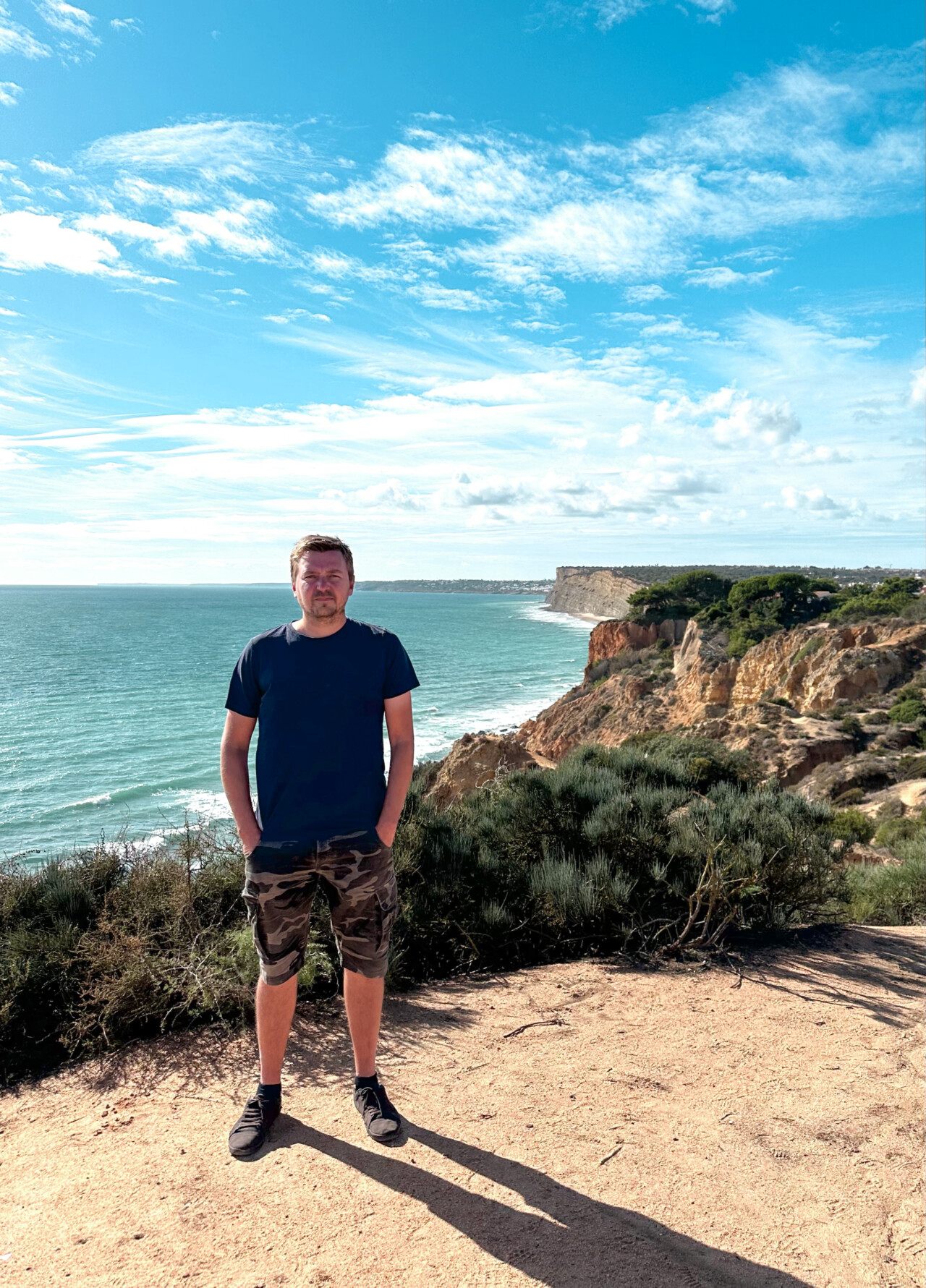 all good concept, man standing on a cliff