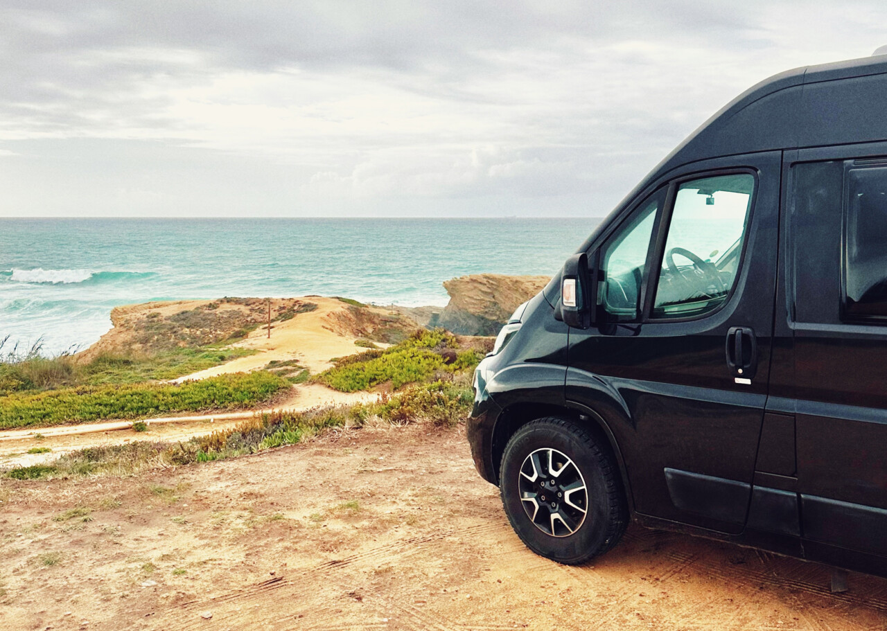 van on a coast with sea