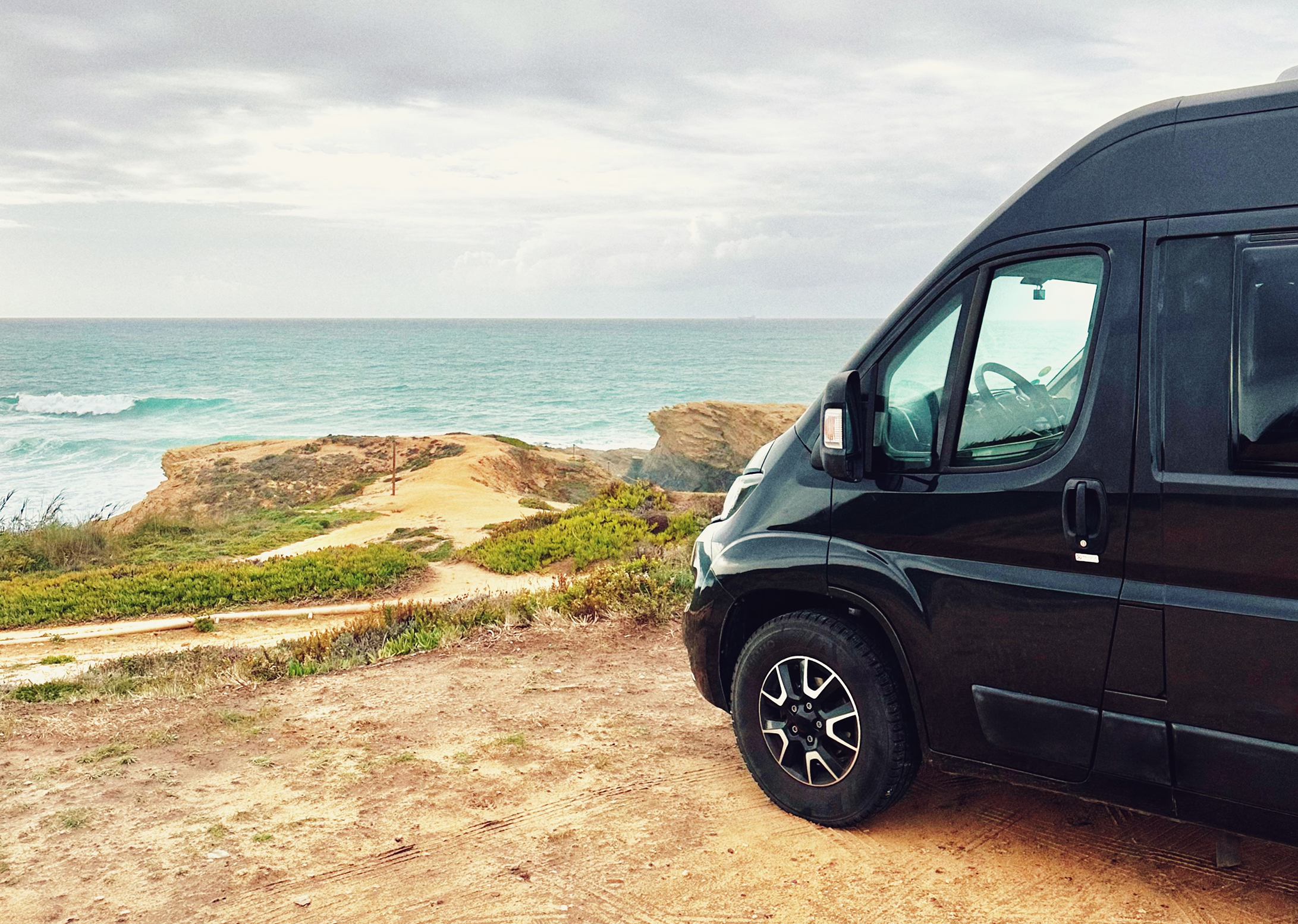 van on a coast with sea