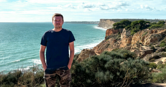 all good concept, man standing on a cliff