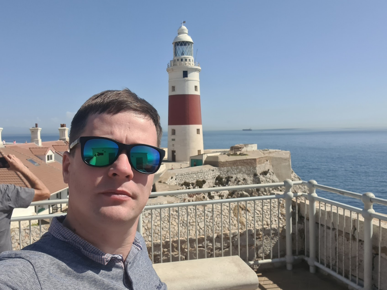 Man taking a selfie with the sea in the background